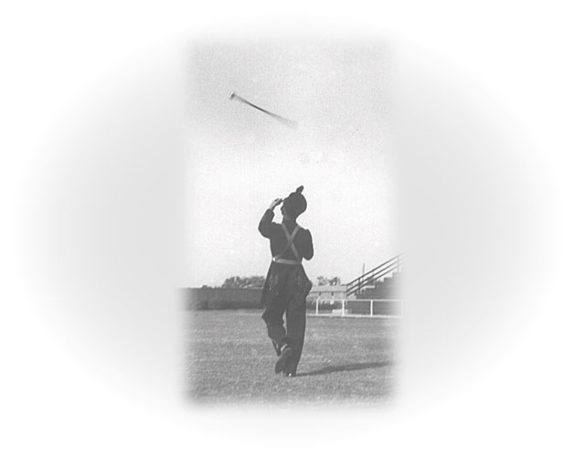 Guy twirling the baton